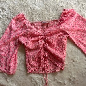 neon pink buckle smocked top